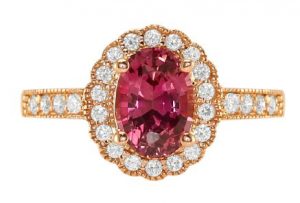 oval reddish-pink sapphire ring